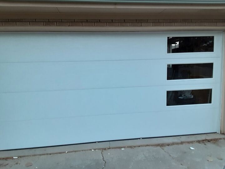 Modern white garage door with side windows