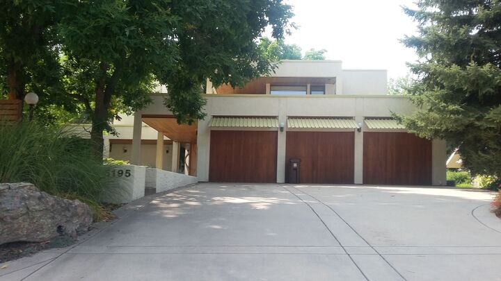 Triple wood garage doors on modern home