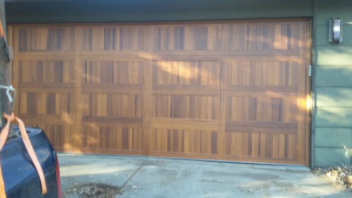 Wood panel garage door installation